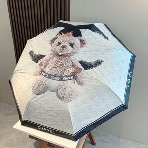 CHANEL Black and White Umbrella with Teddy Bear Design